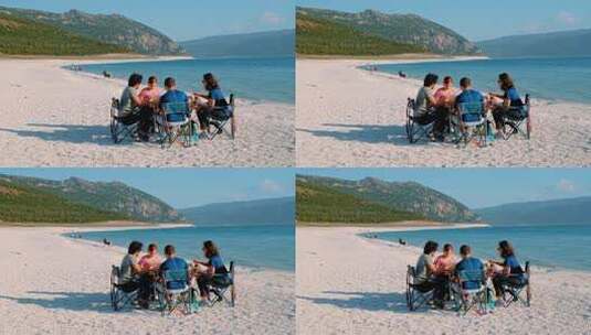一群朋友在海滩上野餐高清在线视频素材下载