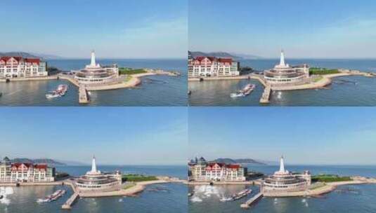 航拍山东青岛旅游地标灯塔小岛蓝色大海高清在线视频素材下载