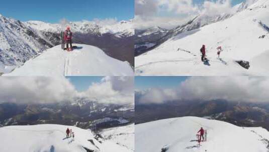 空中：山顶徒步旅行者，滑雪旅游登山雪山冬季运动高清在线视频素材下载