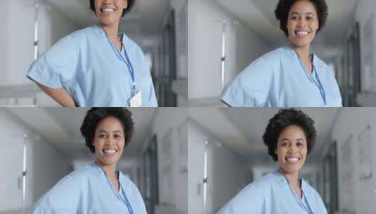 微笑的非裔美国护士在医院走廊上，有复印空高清在线视频素材下载