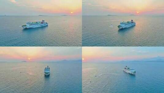 海南三亚橘红色夕阳晚霞行驶的巨型豪华游艇高清在线视频素材下载