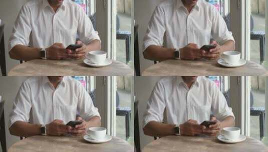 顾客坐在咖啡馆里玩手机高清在线视频素材下载