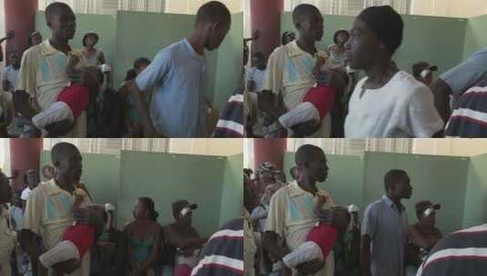 人们在难民中心等待海地地震遇难者的消息高清在线视频素材下载