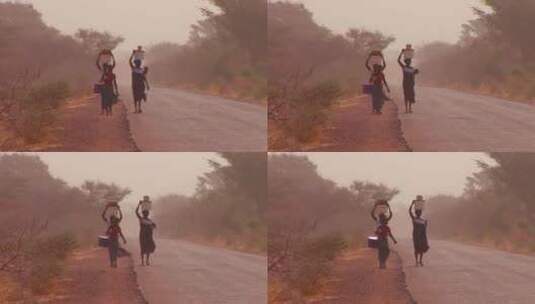 女人举着东西走过沙漠高清在线视频素材下载