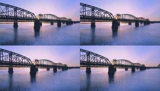清晨日出阳光照耀在鸭绿江铁桥唯美风光高清在线视频素材下载