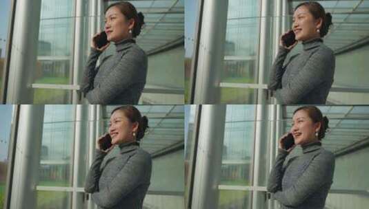 美丽中国女青年白领美女窗边打电话高清在线视频素材下载