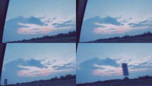 行驶的汽车路上夕阳蓝粉色夕阳天空高清在线视频素材下载
