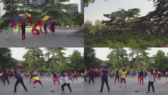 户外广场多人舞动彩色绸带高清在线视频素材下载