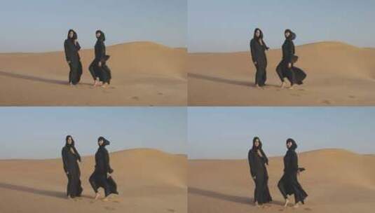 两个美女在沙漠拍照高清在线视频素材下载