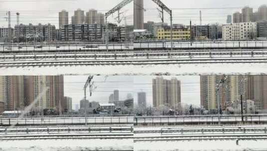 大雪列车出站高铁窗外风景高清在线视频素材下载