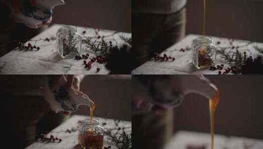 蜂蜜倒在一堆蜂蜜中的慢动作高清在线视频素材下载