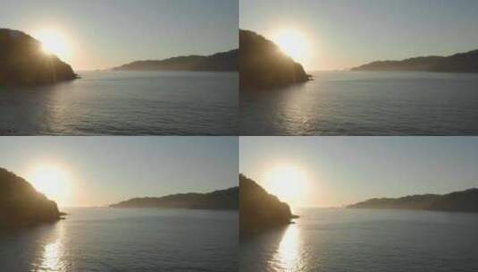 日落时分飞越一个小海湾的海面高清在线视频素材下载