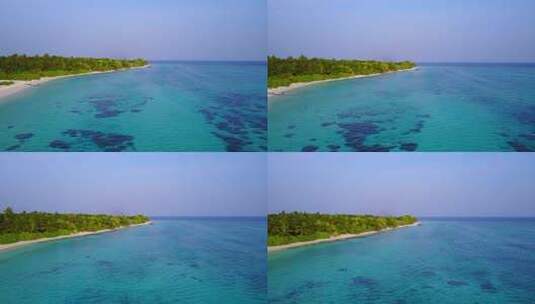 白色天堂海滩和绿松石海背景的日间岛屿景观高清在线视频素材下载