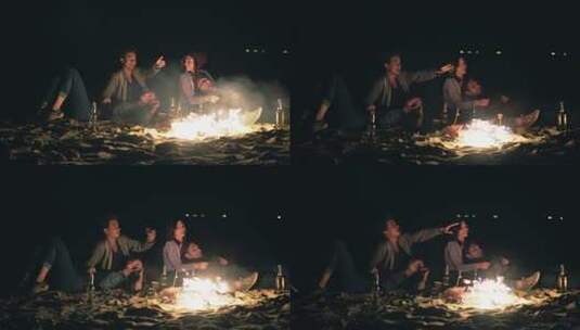 两对可爱的情侣相拥坐在篝火旁看星星高清在线视频素材下载