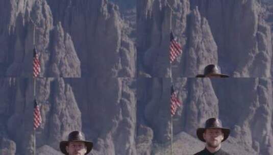 牛仔顶着高山和美国国旗骄傲地站着高清在线视频素材下载