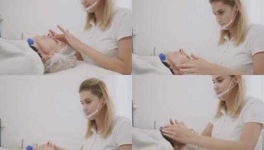 女美容师为妇女做面部按摩高清在线视频素材下载