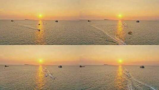 海南三亚橘红色夕阳晚霞行驶的巨型豪华游艇高清在线视频素材下载