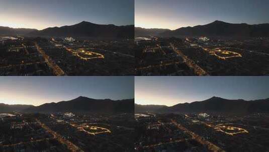 西藏拉萨布达拉宫与大昭寺夜景航拍高清在线视频素材下载