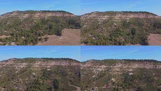 无人机航拍蓝天下的山谷高清在线视频素材下载
