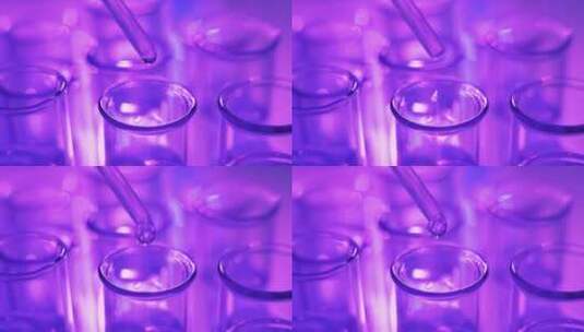 紫光背景下的滴管高清在线视频素材下载