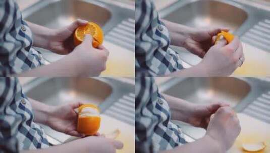 女人正在剥橙子高清在线视频素材下载