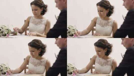 新娘在登记处签署结婚证高清在线视频素材下载