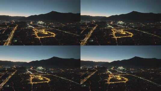 西藏拉萨布达拉宫与大昭寺夜景航拍高清在线视频素材下载