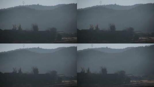 乡村视频云南山区烟雾下隐藏村庄村民远景高清在线视频素材下载