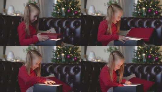 女孩打开圣诞节礼物高清在线视频素材下载
