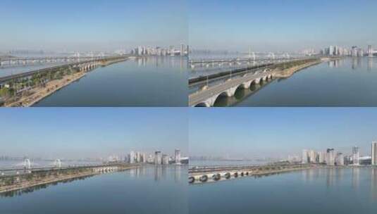 航拍一列电气化快速火车由八里湖驶入九江市高清在线视频素材下载