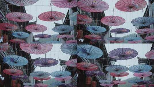 古镇街道上悬挂的油纸伞高清在线视频素材下载