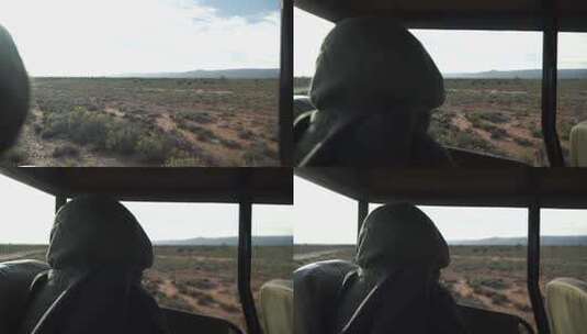 人坐在敞篷车上看荒野高清在线视频素材下载