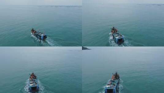 航拍追逐渔船高清在线视频素材下载