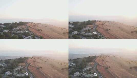 俯瞰戈兰高地房屋和道路的鸟瞰图，以色列日落-asce高清在线视频素材下载
