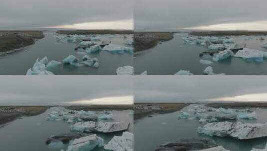 Jökulsárlón冰川泻湖和钻石海滩的鸟瞰图，背景是山脉高清在线视频素材下载