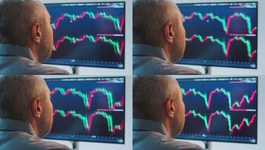 股民在屏幕前查看股市情况高清在线视频素材下载