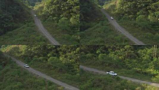 航拍汽车行驶在林间小路上高清在线视频素材下载