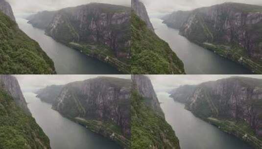 无人机拍摄迷雾谷河上的船只高清在线视频素材下载