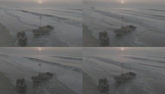 青岛航拍大海沙滩上的船夕阳高清在线视频素材下载