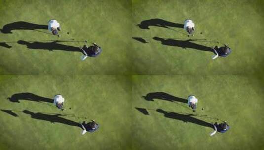 俯拍两人打高尔夫球高清在线视频素材下载