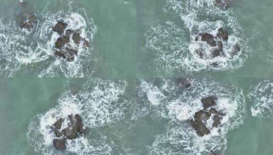 俯拍海岸礁石海浪拍打岩石海水海边浪花潮水高清在线视频素材下载