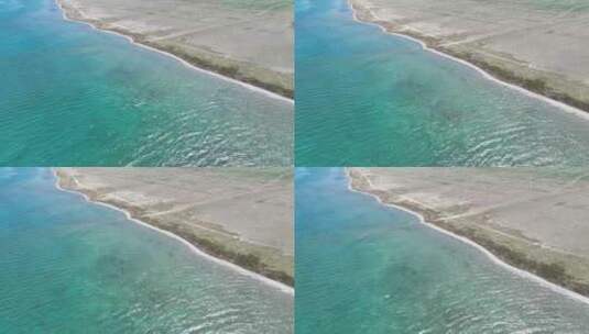 航拍晴天新疆赛里木湖清澈的蓝绿色渐变湖水高清在线视频素材下载