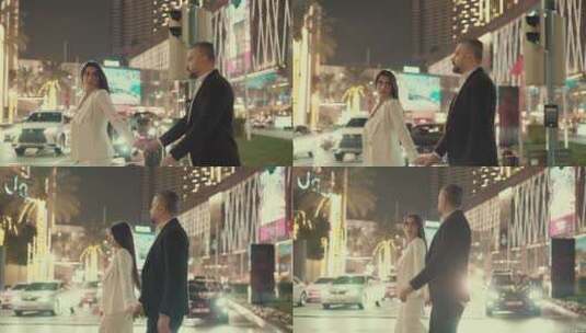 年轻夫妇走在迪拜的街道中间高清在线视频素材下载