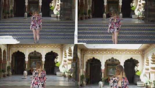 穿着太阳裙的女人走在印度宫殿的台阶上高清在线视频素材下载