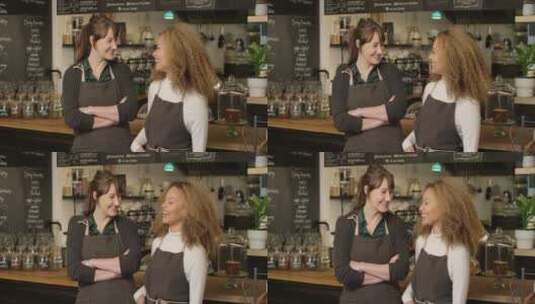两个快乐的女咖啡师互相微笑高清在线视频素材下载