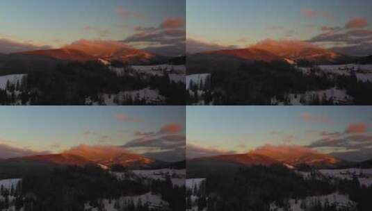 航拍冬季日落时被雪覆盖的森林高清在线视频素材下载