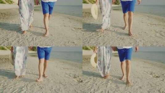 一对年轻夫妇赤脚走在沙滩上高清在线视频素材下载