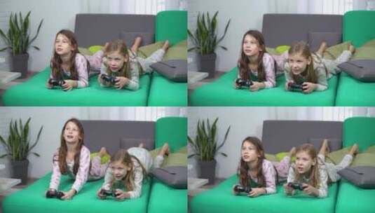 小女孩趴在沙发上玩电子游戏高清在线视频素材下载