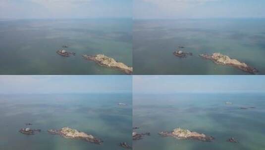 航拍海上礁石岛屿蓝色海洋高清在线视频素材下载