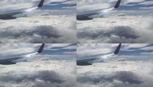 民航飞机机翼穿越云层俯拍地面视频高清在线视频素材下载